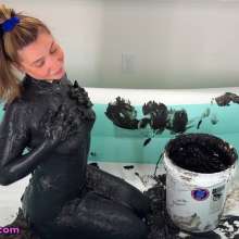 Messy Temptress: Naked and Nasty with Stinky Black Mud in an Inflatable Pool