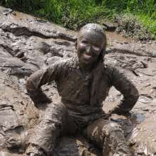 DungeonMasterOne: Mud!  Honeysuckle takes a river mudbath in a tight-fitting blue jumpsuit