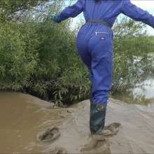 DungeonMasterOne: Mud!  Honeysuckle takes a river mudbath in a tight-fitting blue jumpsuit