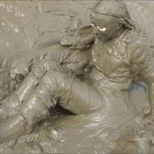 DungeonMasterOne: Mud!  Honeysuckle takes a river mudbath in a tight-fitting blue jumpsuit