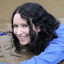 DungeonMasterOne: Mud!  Honeysuckle takes a river mudbath in a tight-fitting blue jumpsuit