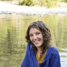 Ag Italian Wetlook: Giulia into the river with black Nike, white socks, jeans, blue sweater