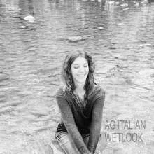 Ag Italian Wetlook: Giulia into the river with black Nike, white socks, jeans, blue sweater