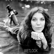 Ag Italian Wetlook: Giulia into the river with black Nike, white socks, jeans, blue sweater