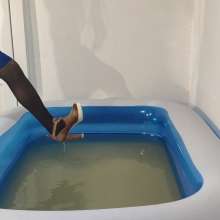 Wetlook Doll: Wet Black Coat and Blue Shorts
