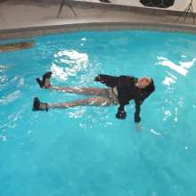 WetlookFashion: Bella Swimming in a Dress, Fishnet Tights and Heels