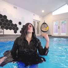 WetlookFashion: Bella Swimming in a Dress, Fishnet Tights and Heels