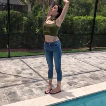 WetlookFashion: Lexie in the Pool Wearing Jeans, Crop Top and Flip Flops