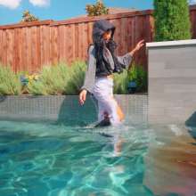 WetlookFashion: Christy Swims Wearing Jeans, Sweater, Boots and a Jacket