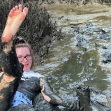 Messy Temptress: Hooters Girl Gets Playful in Pluff Mud