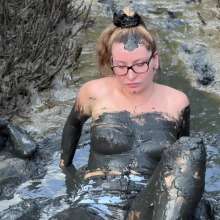 Messy Temptress: Hooters Girl Gets Playful in Pluff Mud