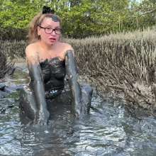 Messy Temptress: Hooters Girl Gets Playful in Pluff Mud