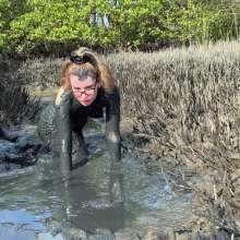 Messy Temptress: Hooters Girl Gets Playful in Pluff Mud