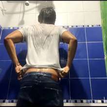 WETColours: Mike in Shower Wearing a Sweater, White T-shirt and Jeans
