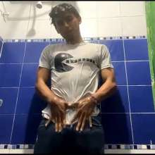 WETColours: Mike in Shower Wearing a Sweater, White T-shirt and Jeans
