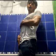 WETColours: Mike in Shower Wearing a Sweater, White T-shirt and Jeans