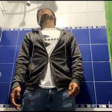 WETColours: Mike in Shower Wearing a Sweater, White T-shirt and Jeans