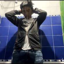 WETColours: Mike in Shower Wearing a Sweater, White T-shirt and Jeans