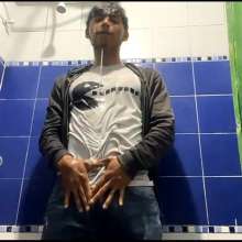 WETColours: Mike in Shower Wearing a Sweater, White T-shirt and Jeans