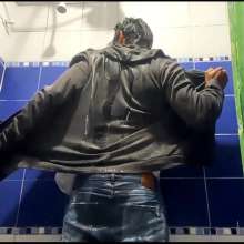 WETColours: Mike in Shower Wearing a Sweater, White T-shirt and Jeans