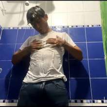WETColours: Mike in Shower Wearing a Sweater, White T-shirt and Jeans