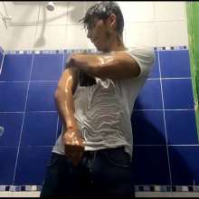 WETColours: Mike in Shower Wearing a Sweater, White T-shirt and Jeans