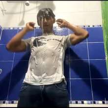 WETColours: Mike in Shower Wearing a Sweater, White T-shirt and Jeans