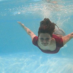 wetkahuna: Kristen modeling in the pool in a miniskirt