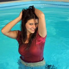 wetkahuna: Kristen modeling in the pool in a miniskirt