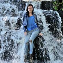 ufa217: Violetta in denim suit gets wet under waterfall.