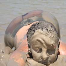 FOXY: Debbie nude and mud covered