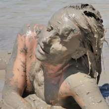 FOXY: Debbie nude and mud covered