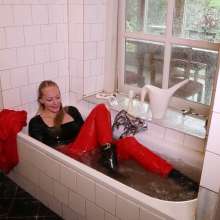eileenvogel: W326 Eileen in red business suit showering after a hard day at work