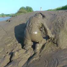 DungeonMasterOne: Waterproof rainwear boilersuit mudbath with Evelyne!