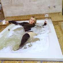 wet.look.me: Wetlook girl gets wet in jacuzzi in stockings and skirt | Wetlook.biz