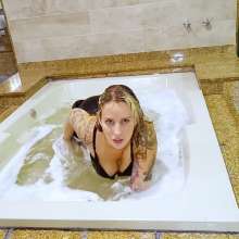 wet.look.me: Wetlook girl gets wet in jacuzzi in stockings and skirt | Wetlook.biz