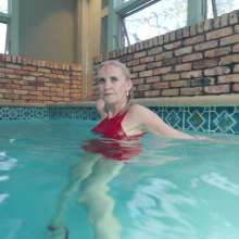 WetlookFashion: Angel Enjoys a Swim Wearing a Sexy Mini Skirt Outfit