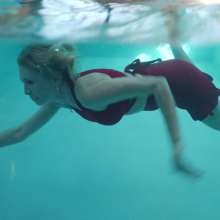 WetlookFashion: Angel Enjoys a Swim Wearing a Sexy Mini Skirt Outfit