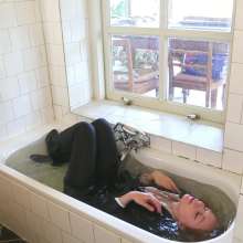 eileenvogel: W449 Eileen in business suit dunking in the bath