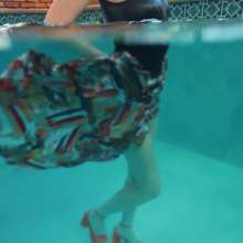 WetlookFashion: Gigi Is Swimming in a Bodysuit and a Long Satin Skirt