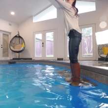 WetlookFashion: Petra Takes a Dip in Jeans, Sweater and Boots