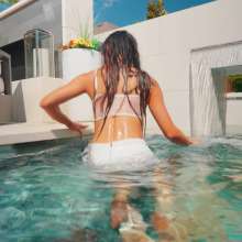 WetlookFashion: Christy Goes for a Swim in a Sexy White Skirt Outfit