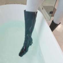 WetlookFashion: Elena Takes a Bath in a Jumpsuit, Boots and Leather Jacket