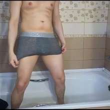 WETColours: Josh in the Shower Wearing a Polo Shirt and Jeans