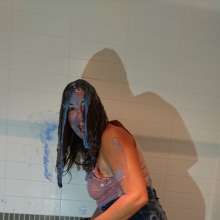 CandyCustard: MyPierogative gunged in pink top, denim skirt and nude tights