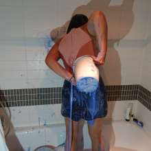 CandyCustard: MyPierogative gunged in pink top, denim skirt and nude tights