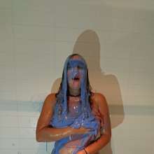 CandyCustard: MyPierogative gunged in pink top, denim skirt and nude tights