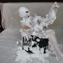 MessyCleo: Cleo enjoys herself in a tub of shaving foam.