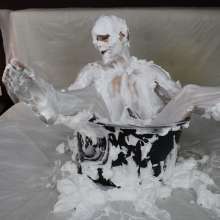 MessyCleo: Cleo enjoys herself in a tub of shaving foam.