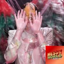 LiquidX: Messyworld gets new host, and she's fearless.